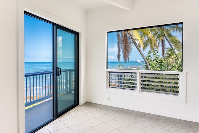 tiled empty room with a water view