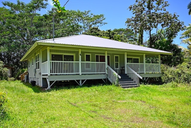 exterior space with a porch and a front yard