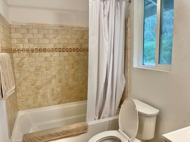 bathroom featuring toilet and shower / bathtub combination with curtain