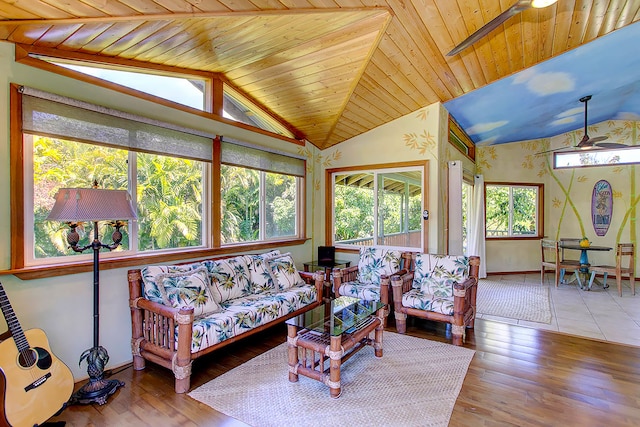 sunroom with wooden ceiling, a wealth of natural light, and vaulted ceiling