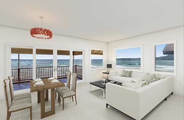 tiled living room featuring a water view