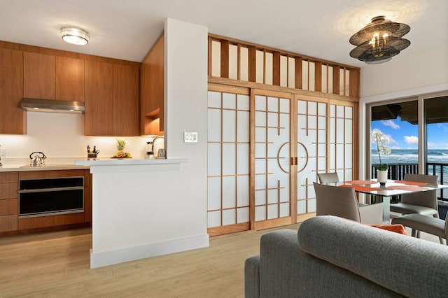 kitchen featuring stovetop and light wood-type flooring