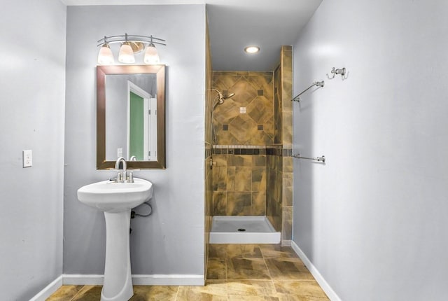 bathroom with a tile shower