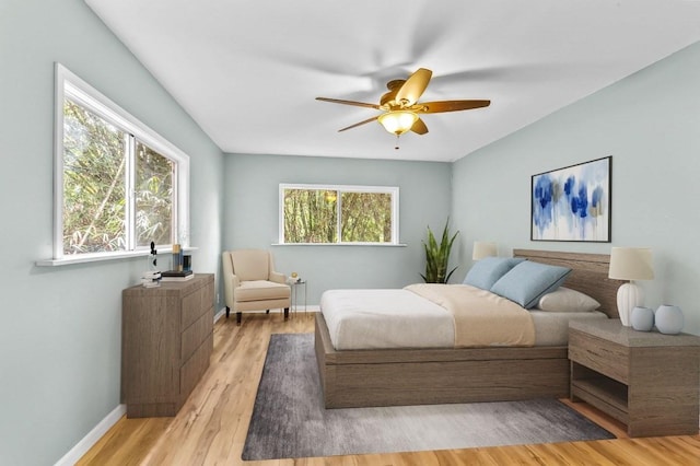 bedroom featuring light wood-type flooring and ceiling fan