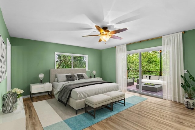 bedroom with ceiling fan, access to outside, and light hardwood / wood-style floors