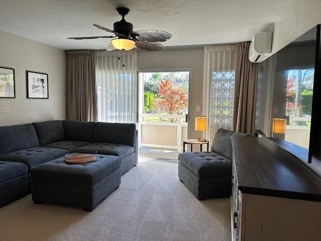 carpeted living room featuring ceiling fan, a textured ceiling, and a wall unit AC