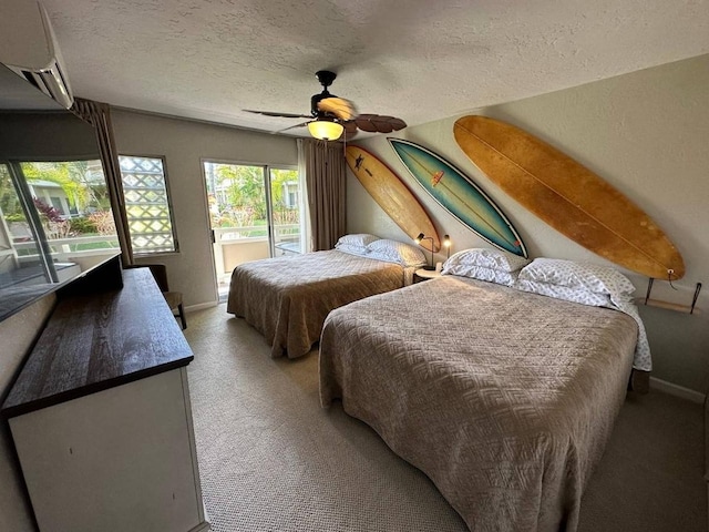 bedroom with ceiling fan, a textured ceiling, access to outside, light colored carpet, and a wall unit AC