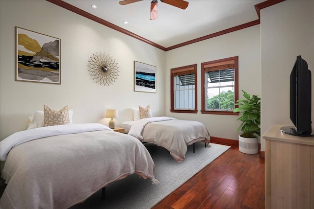 bedroom with crown molding, ceiling fan, and dark hardwood / wood-style flooring