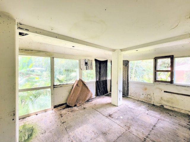 unfurnished sunroom featuring a healthy amount of sunlight