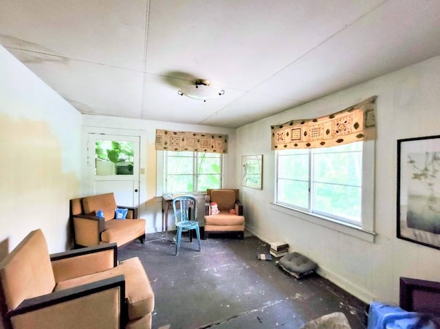 sitting room with concrete flooring