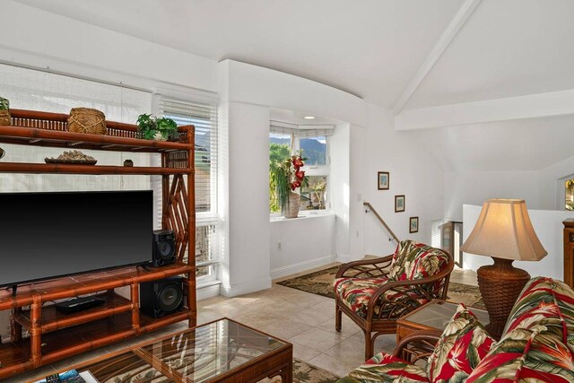 tiled living room with vaulted ceiling