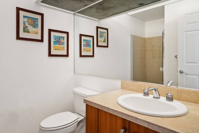 bathroom with vanity with extensive cabinet space and toilet