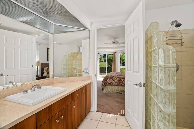 bathroom with vanity with extensive cabinet space, tile flooring, and ceiling fan