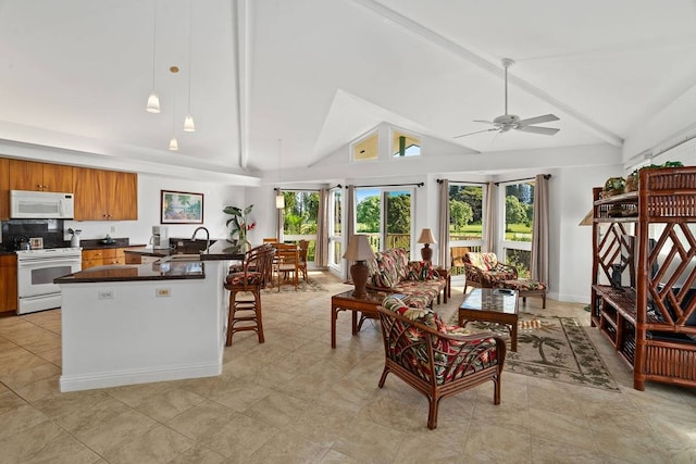 kitchen featuring white appliances, ceiling fan, light tile floors, high vaulted ceiling, and decorative light fixtures