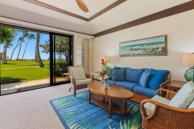 living room featuring carpet, ceiling fan, and lofted ceiling