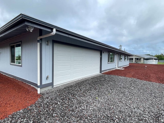 view of side of property with a garage