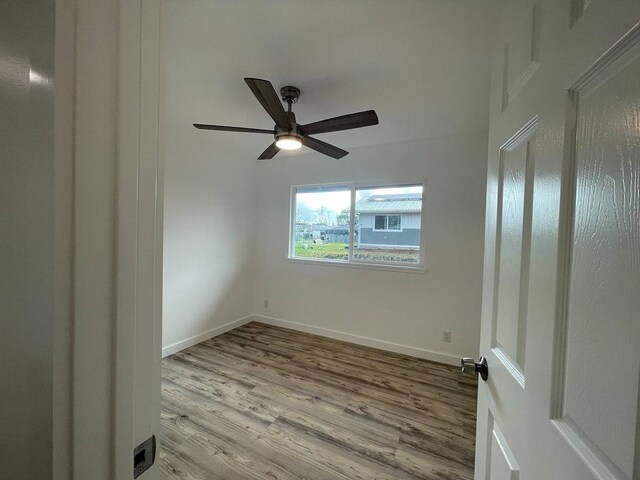 unfurnished room with ceiling fan and light hardwood / wood-style floors