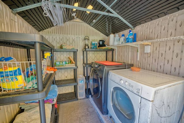 clothes washing area featuring washer and clothes dryer