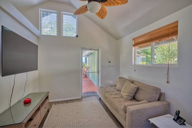 living room featuring ceiling fan and high vaulted ceiling