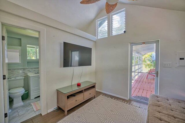 living room with ceiling fan, plenty of natural light, and light tile flooring