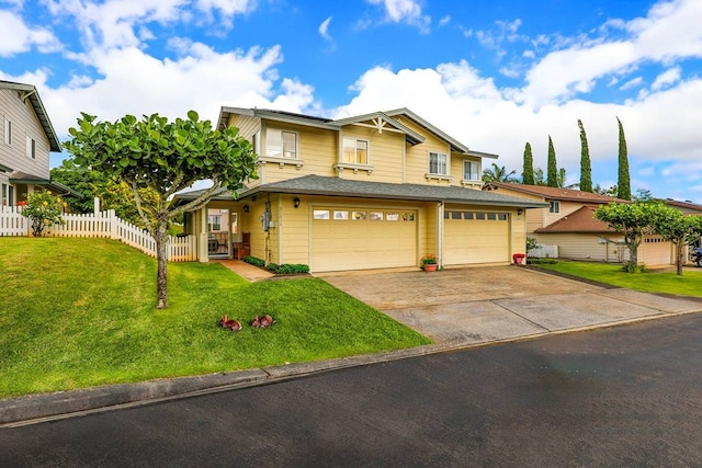 view of front of home with a front lawn and a garage