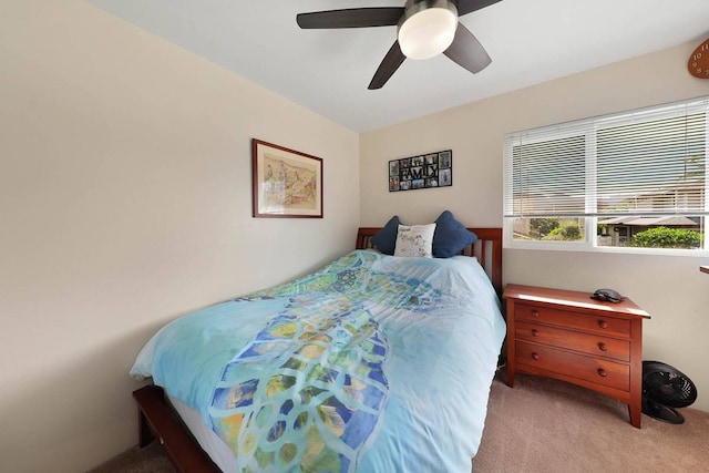 bedroom featuring light carpet and ceiling fan