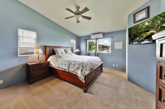 carpeted bedroom with vaulted ceiling, ceiling fan, and an AC wall unit