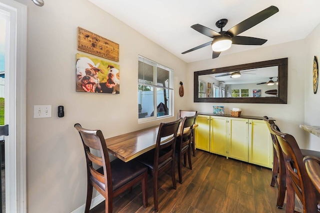 dining area featuring ceiling fan and dark hardwood / wood-style floors