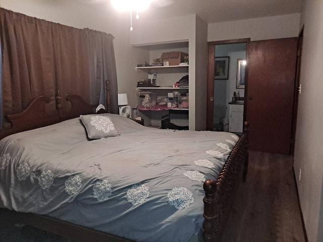 bedroom featuring dark wood-type flooring