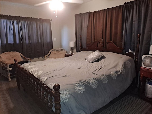 bedroom featuring ceiling fan and dark wood-type flooring