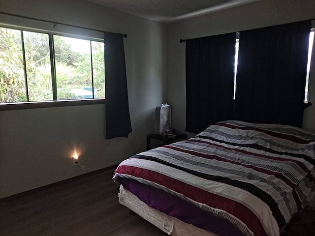 bedroom featuring dark wood-type flooring