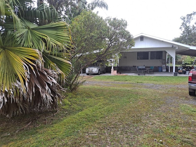 view of yard with a carport