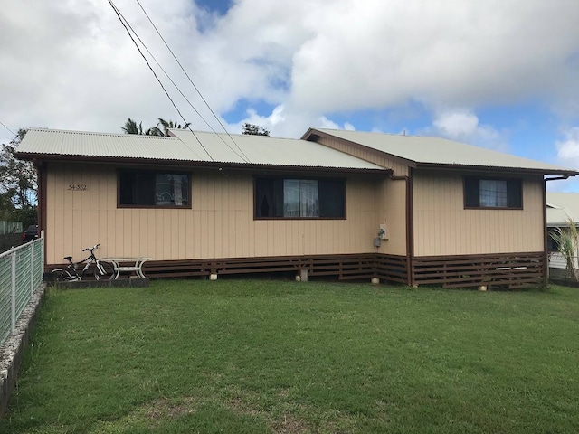 back of house with a yard