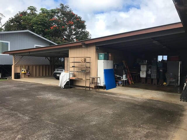 garage featuring a carport