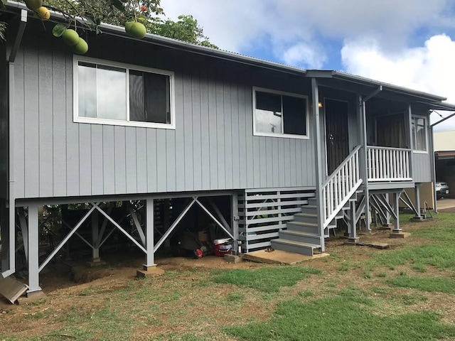 rear view of house with a yard