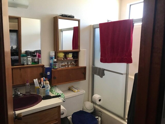 bathroom with large vanity and toilet