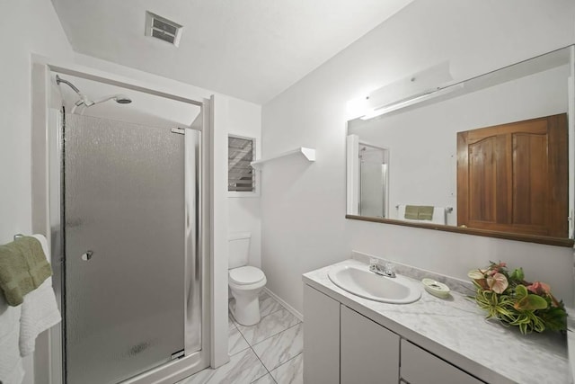 bathroom featuring a shower with door, vanity, and toilet