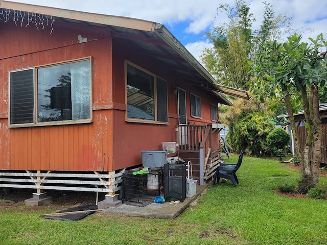 view of home's exterior featuring a yard