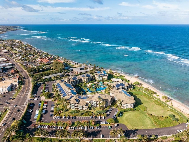 bird's eye view with a beach view and a water view