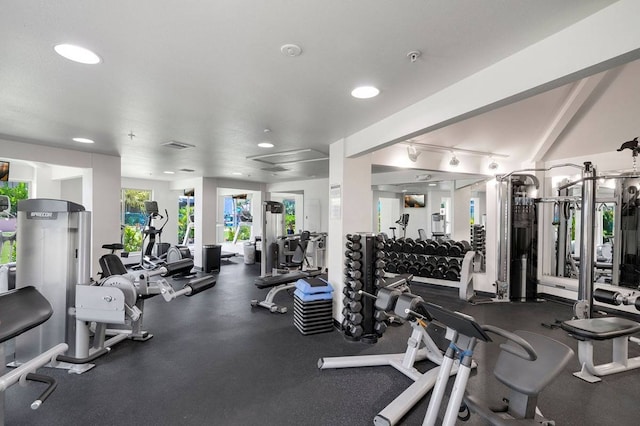 gym featuring track lighting