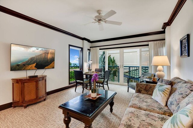 living room with light carpet, crown molding, and ceiling fan