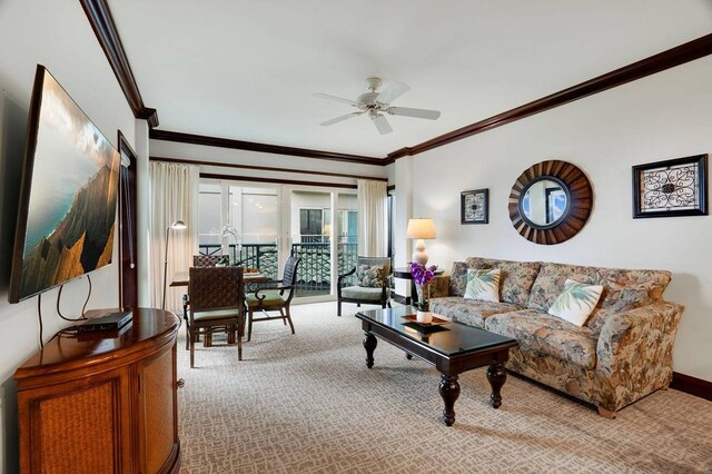 living room featuring light carpet, ceiling fan, and ornamental molding