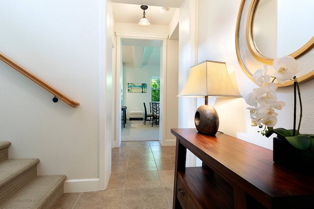 corridor featuring light tile floors