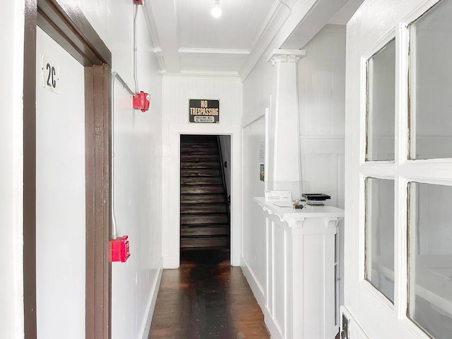 hall with dark hardwood / wood-style flooring and ornate columns