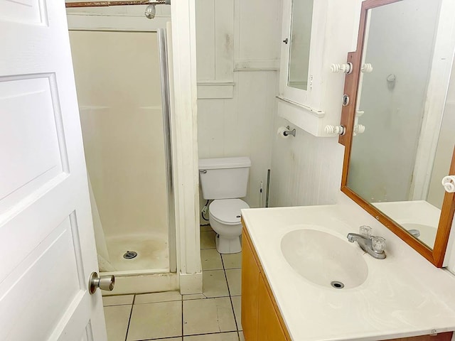 bathroom with oversized vanity, toilet, walk in shower, and tile flooring