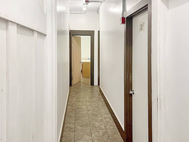 hallway with light tile flooring