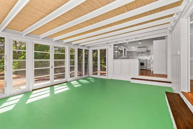 unfurnished sunroom featuring sink