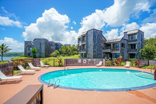 view of swimming pool with a patio area