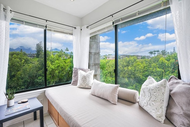 tiled bedroom featuring multiple windows