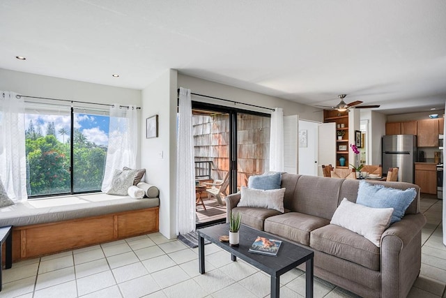 tiled living room with ceiling fan